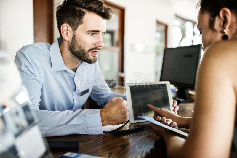 Guests checking into a hotel stock photo