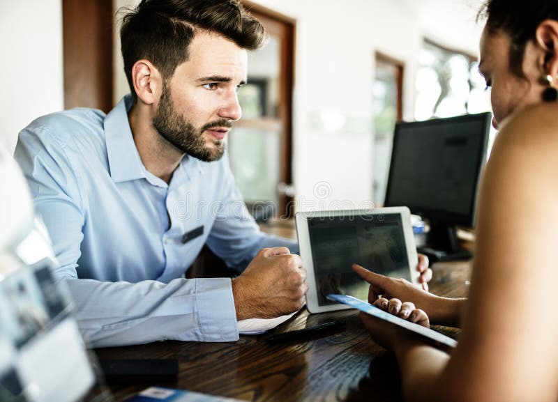 Guests checking in to a hotel royalty free stock image