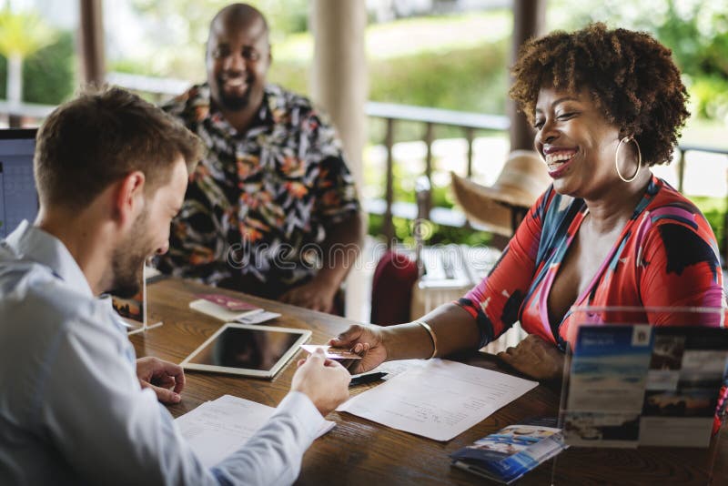 Guests checking in to a hotel stock photos