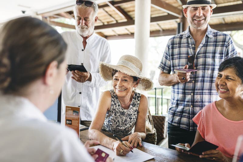 Guests checking in to a hotel stock images
