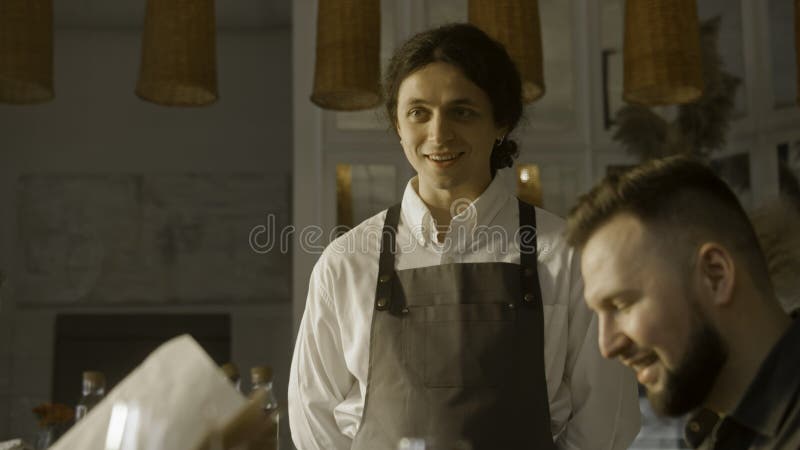 Guests Watching Menu and Talking with Waiter Stock Photo - Image of ...