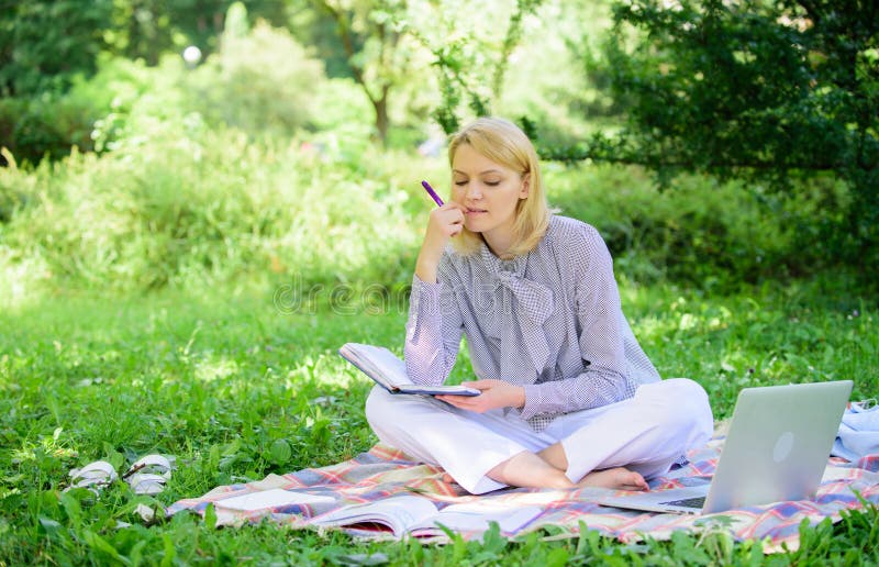 Guide starting freelance career. Become successful freelancer. Woman with laptop sit on rug grass meadow. Girl with. Notepad write note. Business lady freelance stock image Guide starting freelance career. Become successful freelancer. Woman with laptop sit on rug grass meadow. Girl with. Notepad write note. Business lady freelance stock image