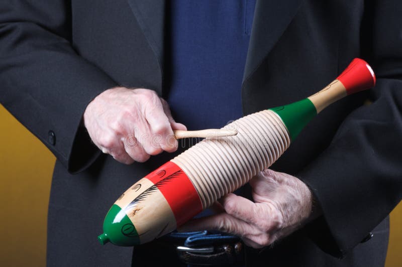 Guiro Goard Being Played stock photo. Image of horizontal 7603698