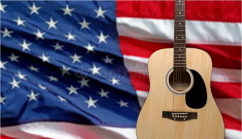 Acoustic guitar close up on american flag