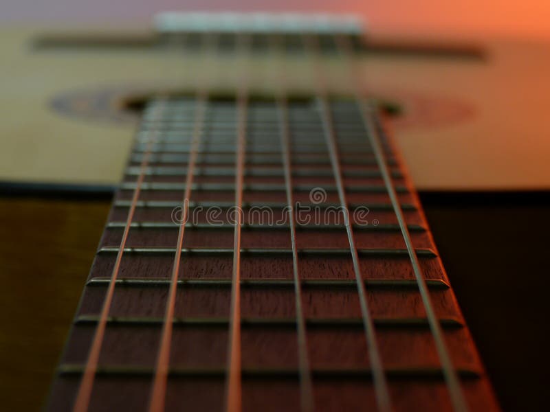 Guitar arm with the focus on a part of the strings royalty free stock photo