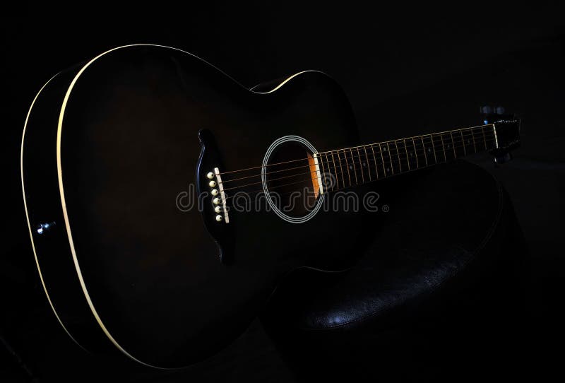 Guitar on a Black Background. Stock Photo Image of band, chords 100477440