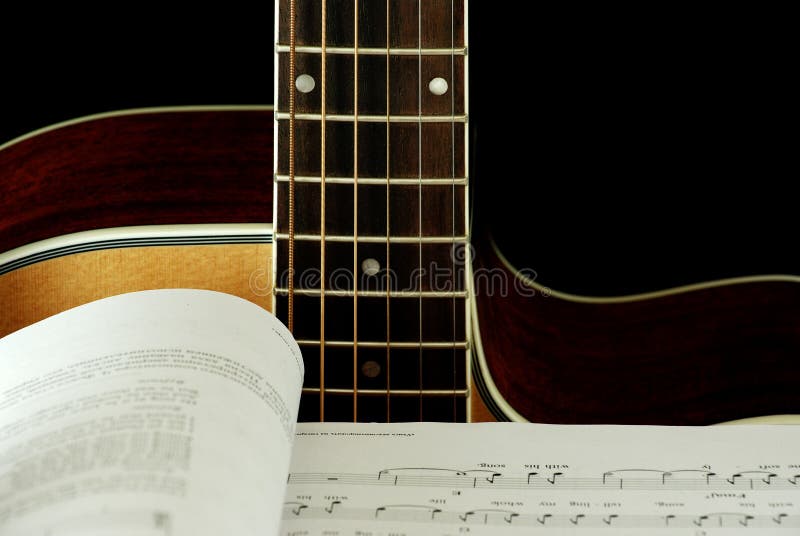 Guitar and book with notes