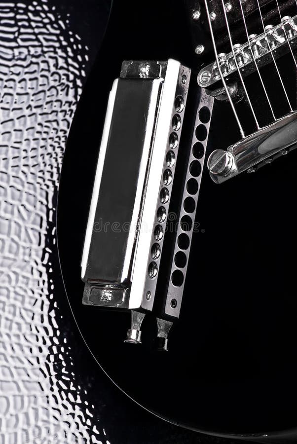 Close-up of electric guitar and harmonica