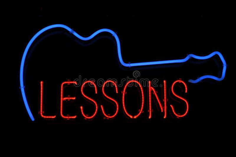 Guitar Lessons Neon Sign royalty free stock photo