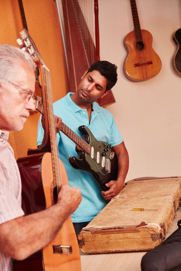 Guitar Makers Testing Guitars Stock Photo Image of fixing, blue 99628732
