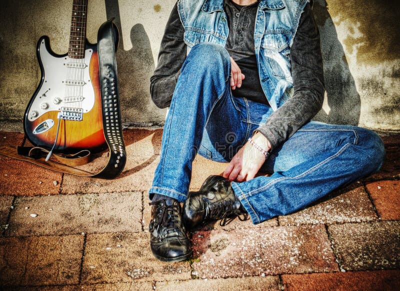 Guitar and Man Against the Wall Stock Photo - Image of outdoors ...