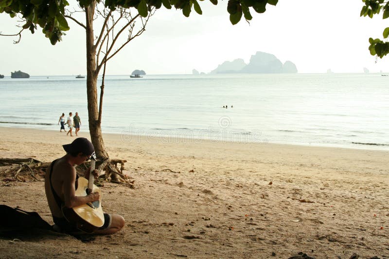 guitar man krabi beach thailand