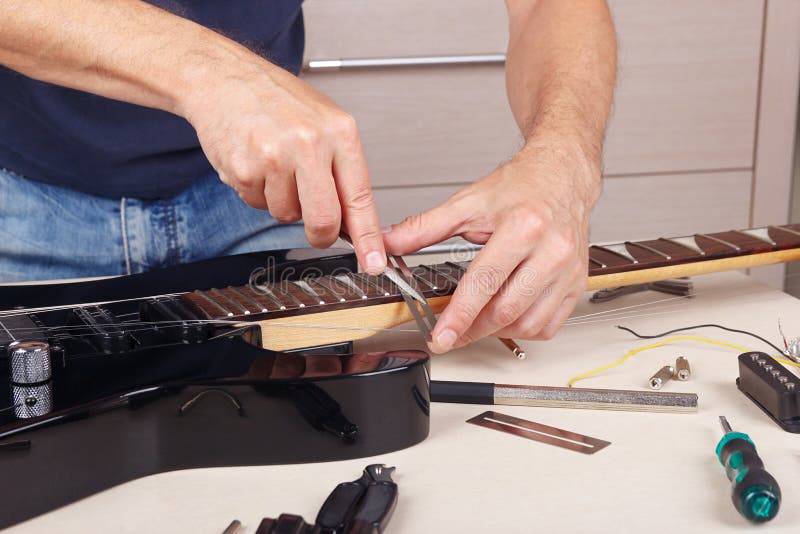 Guitar Technician Tune the Height Bridge on Electric Guitar at Workplace Stock Image Image of