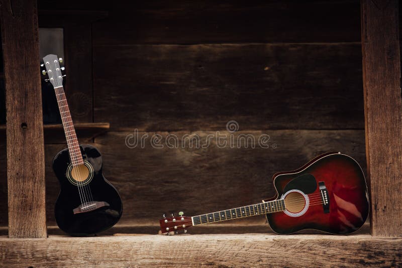 Guitar on a wooden porch stock image. Image of retro 70546207