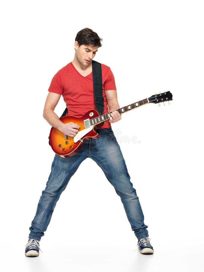 Guitarist man plays on the electric guitar