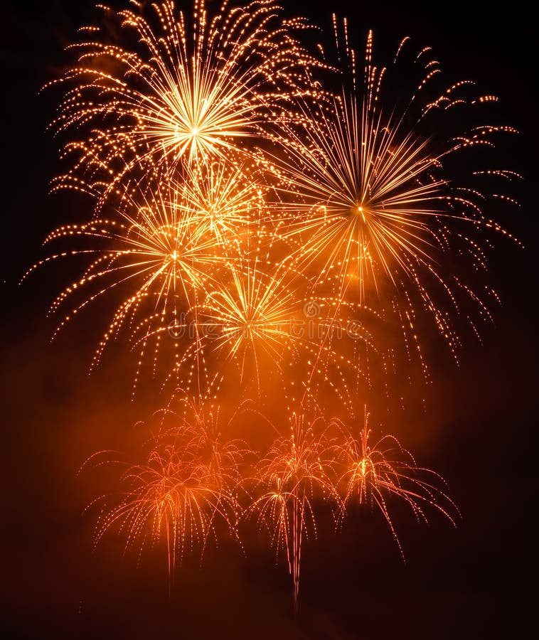 Golden fireworks in colorful shades of yellow and orange. Golden fireworks in colorful shades of yellow and orange