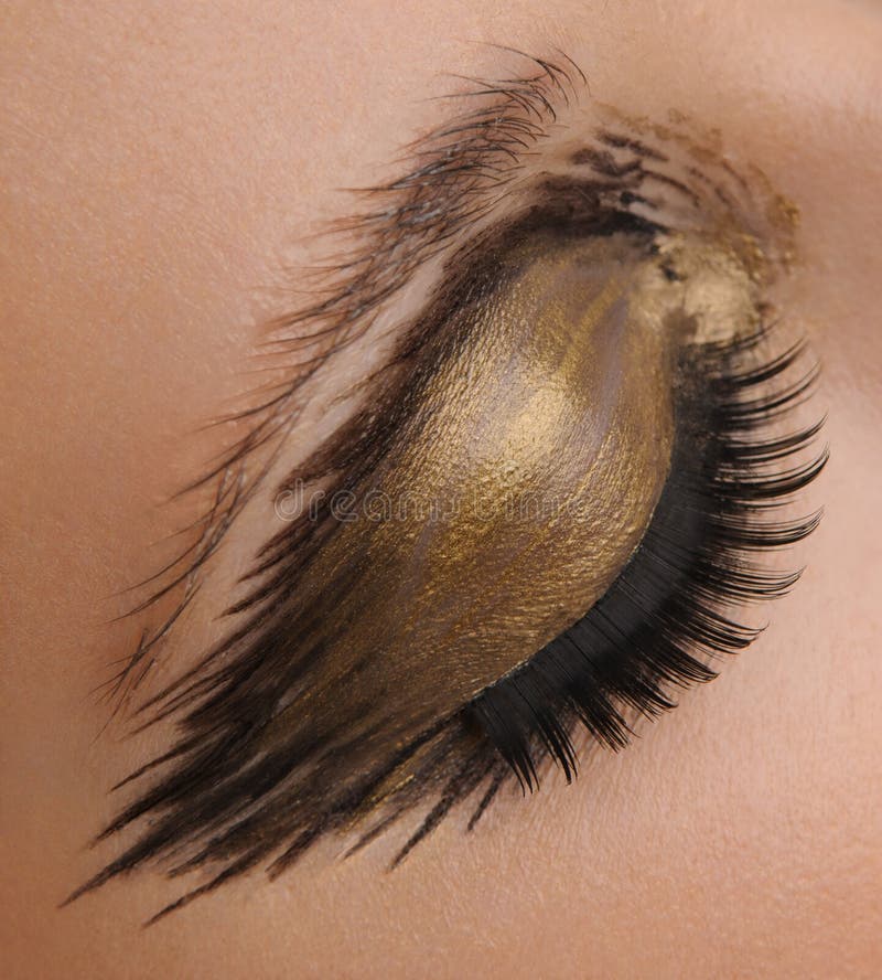 Guld- glamourögonsmink arkivbild Guld- glamourögonsmink arkivbild