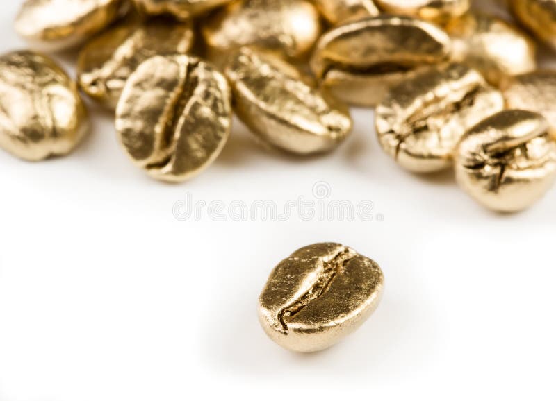 Guld- kaffebönor royaltyfria foton Guld- kaffebönor royaltyfria foton