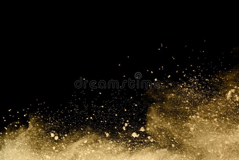 Guld- pulverexplosion p? svart bakgrund Frysningr? relse arkivfoton