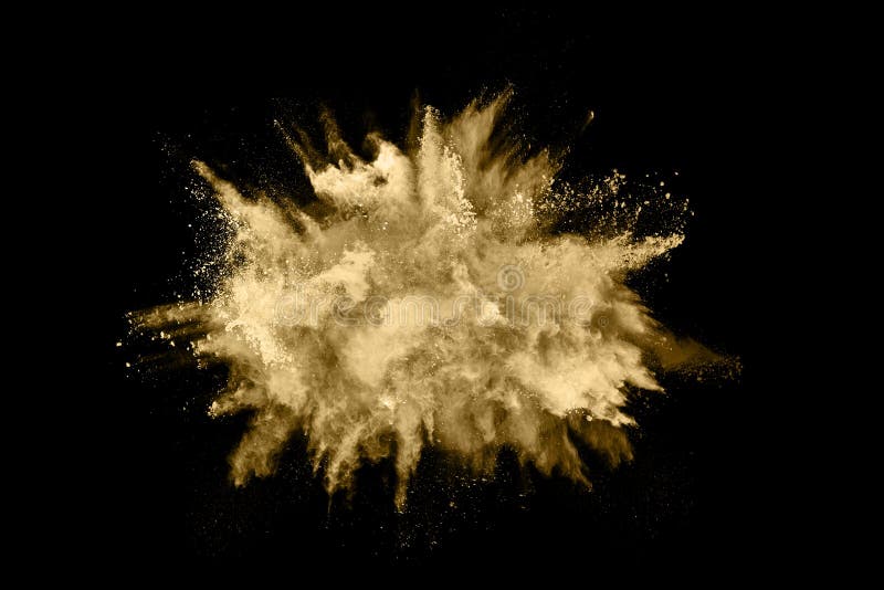 Guld- pulverexplosion p? svart bakgrund royaltyfri foto