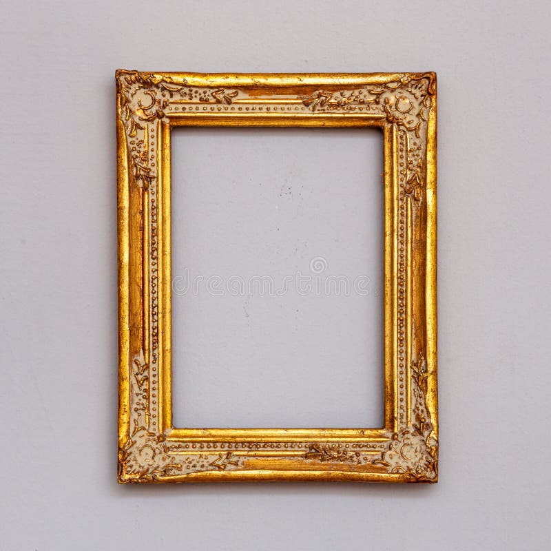 Guld- tappningbildram på en vägg royaltyfria bilder Guld- tappningbildram på en vägg royaltyfria bilder
