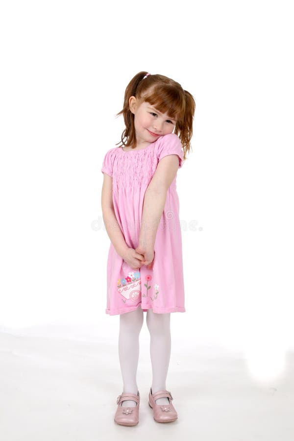 Söt flicka i rosa klänning fotografering för bildbyråer