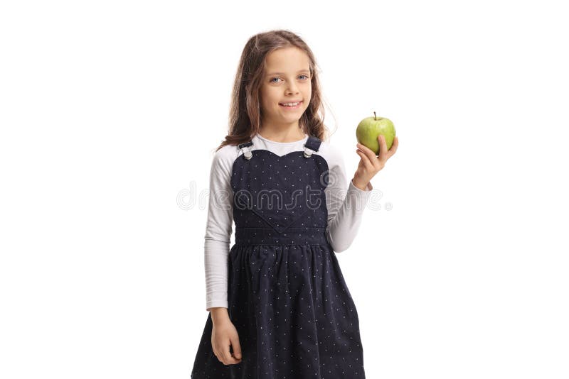 Gullig liten flicka som rymmer ett äpple och le fotografering för bildbyråer Gullig liten flicka som rymmer ett äpple och le fotografering för bildbyråer