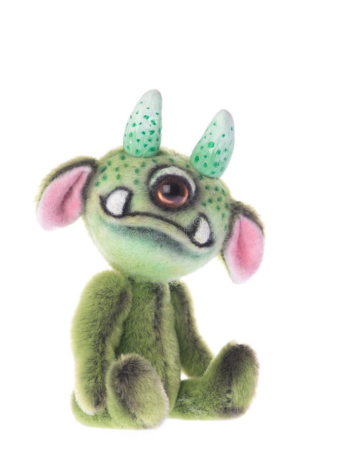 Gullig välfylld en synad leksak för djurgräsplanmonster arkivbilder Gullig välfylld en synad leksak för djurgräsplanmonster arkivbilder