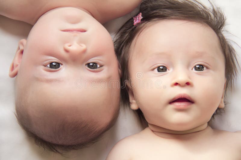 This is a picture of fraternal twins, a boy and a girl, 3 months old. This is a picture of fraternal twins, a boy and a girl, 3 months old.