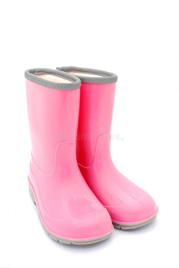 A pair of pink kids gum boots for rainy weather. Image isolated on white studio background.