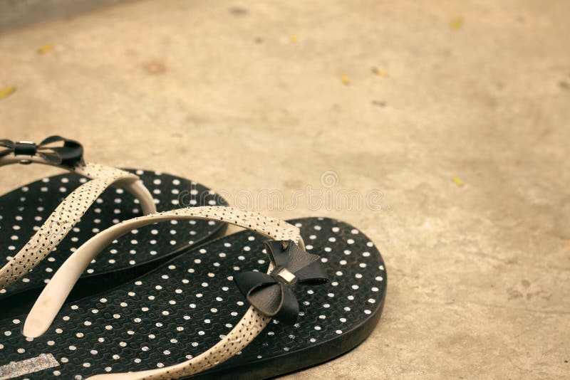 Black rubber white polka dots flip-flops - slippers. Black rubber white polka dots flip-flops - slippers