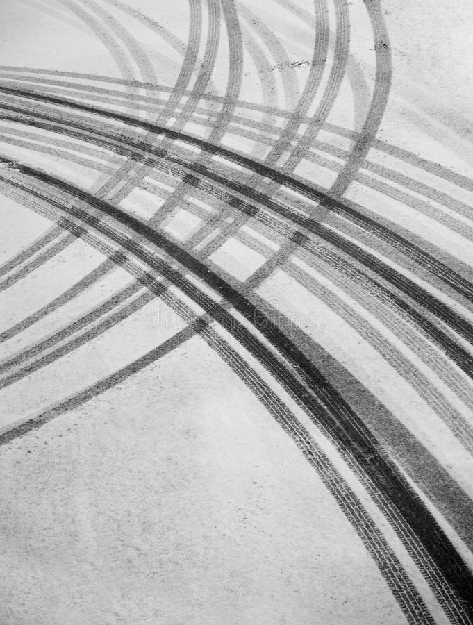 Tire tracks on asphalt in snow. Tire tracks on asphalt in snow