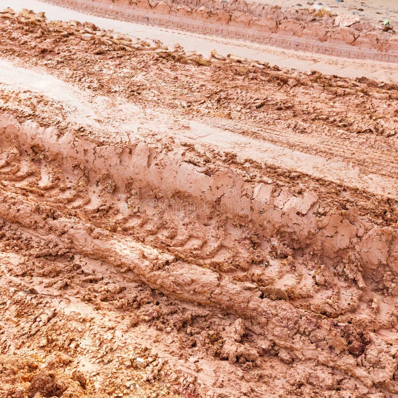 Close up tire track on red color lateritic soil. Close up tire track on red color lateritic soil