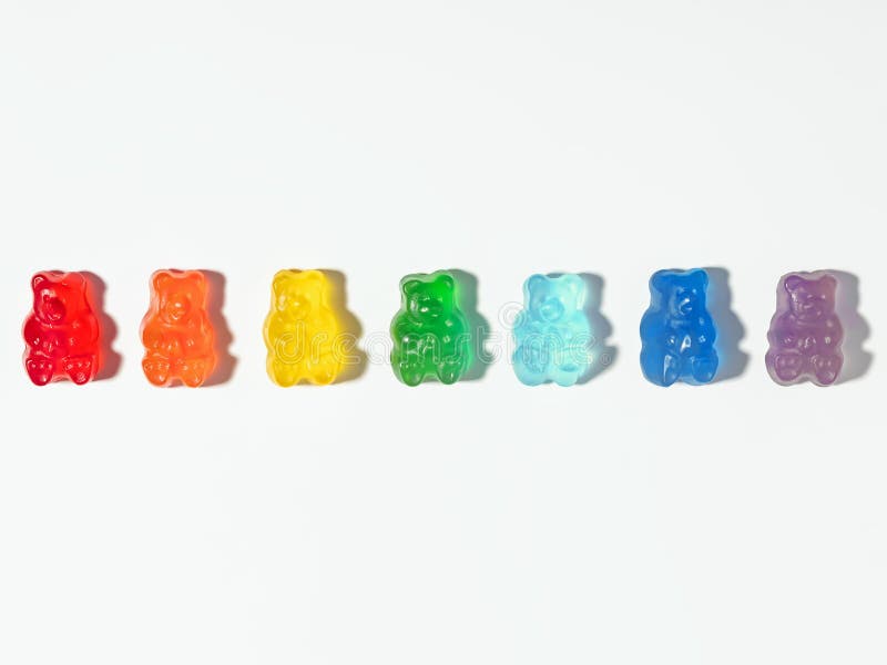 Gummy bears in rainbow colors, isolated on white background