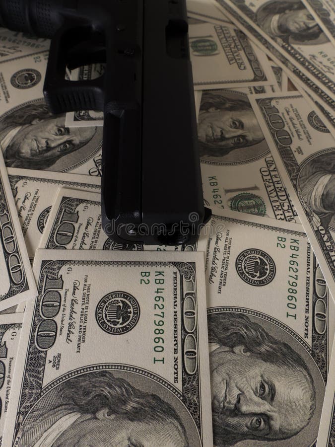 Gun on US Dollar Banknotes, Crime and Corruption. Stock Photo - Image ...