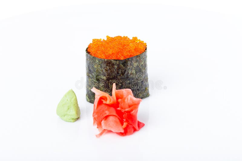Gunkan sushi stuffed with red tobiko caviar. Served with heap of ginger and wasabi. Macro. Can be used as a whole background royalty free stock photo Gunkan sushi stuffed with red tobiko caviar. Served with heap of ginger and wasabi. Macro. Can be used as a whole background royalty free stock photo