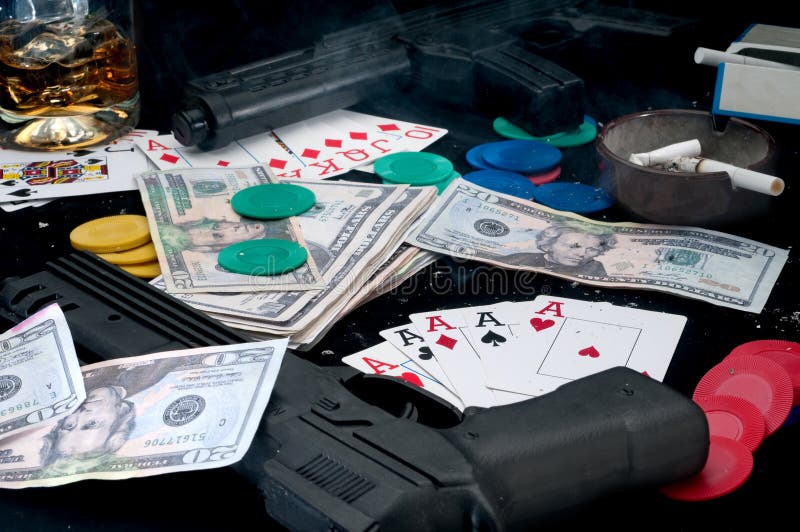 Guns and cards on a table - gambling