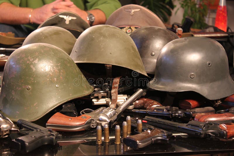 Guns and war helmets