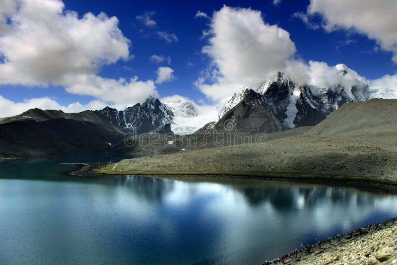 Gurudongmar Lake Buddhist Flag flutters in GuruDongmar Lake.JPG Buddhist Holy Lake -Gurudongmar Lake Location	North Sikkim, India Coordinates	28.02°N 88.71°ECoordinates: 28.02°N 88.71°E Basin countries	Sikkim, India Surface area	118 hectares 290 acres Shore length1	5.34 kilometres 3.32 mi Surface elevation	17,004 ft 5,183 m Settlements Mangan, North Sikkim 122 km. Lachen, North Sikkim 67 km. 1 Shore length is not a well-defined measure. Gurudongmar in May. Gurudongmar Lake in Sikkim. Gurudongmar Lake is one of the highest lakes in the world and in India, located at an altitude of 17,800 ft 5,430 m in the Indian state of Sikkim. Gurudongmar Lake Buddhist Flag flutters in GuruDongmar Lake.JPG Buddhist Holy Lake -Gurudongmar Lake Location	North Sikkim, India Coordinates	28.02°N 88.71°ECoordinates: 28.02°N 88.71°E Basin countries	Sikkim, India Surface area	118 hectares 290 acres Shore length1	5.34 kilometres 3.32 mi Surface elevation	17,004 ft 5,183 m Settlements Mangan, North Sikkim 122 km. Lachen, North Sikkim 67 km. 1 Shore length is not a well-defined measure. Gurudongmar in May. Gurudongmar Lake in Sikkim. Gurudongmar Lake is one of the highest lakes in the world and in India, located at an altitude of 17,800 ft 5,430 m in the Indian state of Sikkim.