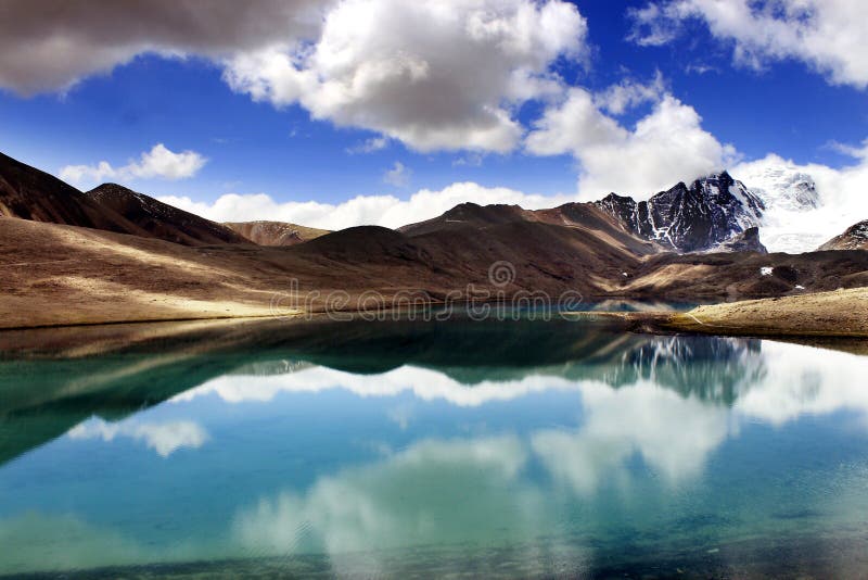 Gurudongmar Lake Buddhist Flag flutters in GuruDongmar Lake.JPG Buddhist Holy Lake -Gurudongmar Lake Location	North Sikkim, India Coordinates	28.02°N 88.71°ECoordinates: 28.02°N 88.71°E Basin countries	Sikkim, India Surface area	118 hectares 290 acres Shore length1	5.34 kilometres 3.32 mi Surface elevation	17,004 ft 5,183 m Settlements Mangan, North Sikkim 122 km. Lachen, North Sikkim 67 km. 1 Shore length is not a well-defined measure. Gurudongmar in May. Gurudongmar Lake in Sikkim. Gurudongmar Lake is one of the highest lakes in the world and in India, located at an altitude of 17,800 ft 5,430 m in the Indian state of Sikkim. Gurudongmar Lake Buddhist Flag flutters in GuruDongmar Lake.JPG Buddhist Holy Lake -Gurudongmar Lake Location	North Sikkim, India Coordinates	28.02°N 88.71°ECoordinates: 28.02°N 88.71°E Basin countries	Sikkim, India Surface area	118 hectares 290 acres Shore length1	5.34 kilometres 3.32 mi Surface elevation	17,004 ft 5,183 m Settlements Mangan, North Sikkim 122 km. Lachen, North Sikkim 67 km. 1 Shore length is not a well-defined measure. Gurudongmar in May. Gurudongmar Lake in Sikkim. Gurudongmar Lake is one of the highest lakes in the world and in India, located at an altitude of 17,800 ft 5,430 m in the Indian state of Sikkim.