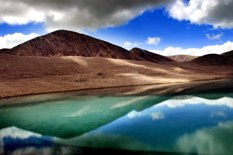 Gurudongmar Lake Buddhist Flag flutters in GuruDongmar Lake.JPG Buddhist Holy Lake -Gurudongmar Lake Location	North Sikkim, India Coordinates	28.02°N 88.71°ECoordinates: 28.02°N 88.71°E Basin countries	Sikkim, India Surface area	118 hectares 290 acres Shore length1	5.34 kilometres 3.32 mi Surface elevation	17,004 ft 5,183 m Settlements Mangan, North Sikkim 122 km. Lachen, North Sikkim 67 km. 1 Shore length is not a well-defined measure. Gurudongmar in May. Gurudongmar Lake in Sikkim. Gurudongmar Lake is one of the highest lakes in the world and in India, located at an altitude of 17,800 ft 5,430 m in the Indian state of Sikkim. Gurudongmar Lake Buddhist Flag flutters in GuruDongmar Lake.JPG Buddhist Holy Lake -Gurudongmar Lake Location	North Sikkim, India Coordinates	28.02°N 88.71°ECoordinates: 28.02°N 88.71°E Basin countries	Sikkim, India Surface area	118 hectares 290 acres Shore length1	5.34 kilometres 3.32 mi Surface elevation	17,004 ft 5,183 m Settlements Mangan, North Sikkim 122 km. Lachen, North Sikkim 67 km. 1 Shore length is not a well-defined measure. Gurudongmar in May. Gurudongmar Lake in Sikkim. Gurudongmar Lake is one of the highest lakes in the world and in India, located at an altitude of 17,800 ft 5,430 m in the Indian state of Sikkim.