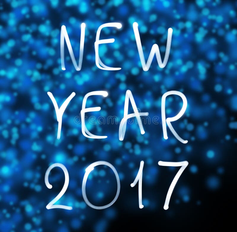 Happy new year 2017 on snowflakes background. Happy new year 2017 written with neon light. Happy new year 2017 on snowflakes background. Happy new year 2017 written with neon light.