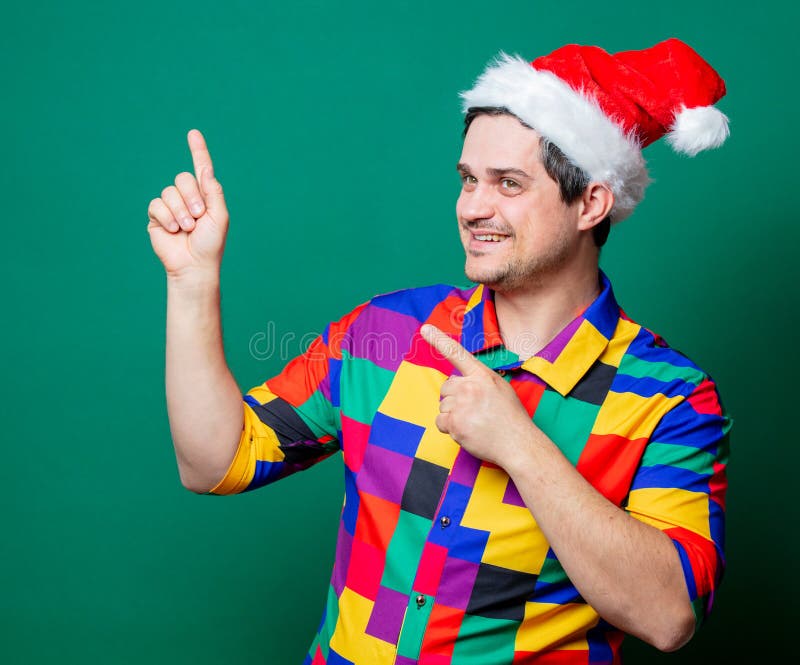 Guy in Christmas hat and vintage shirt stock image