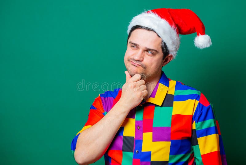 Guy in Christmas hat and vintage shirt stock image