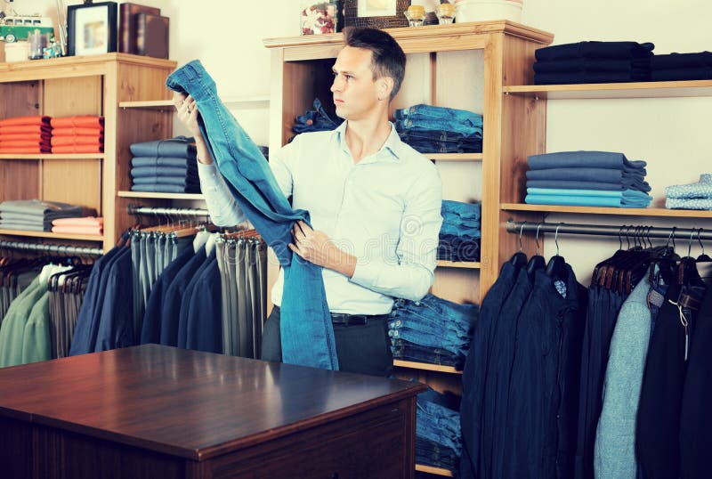Guy is Deciding on for New Jeans Stock Image - Image of indoors ...