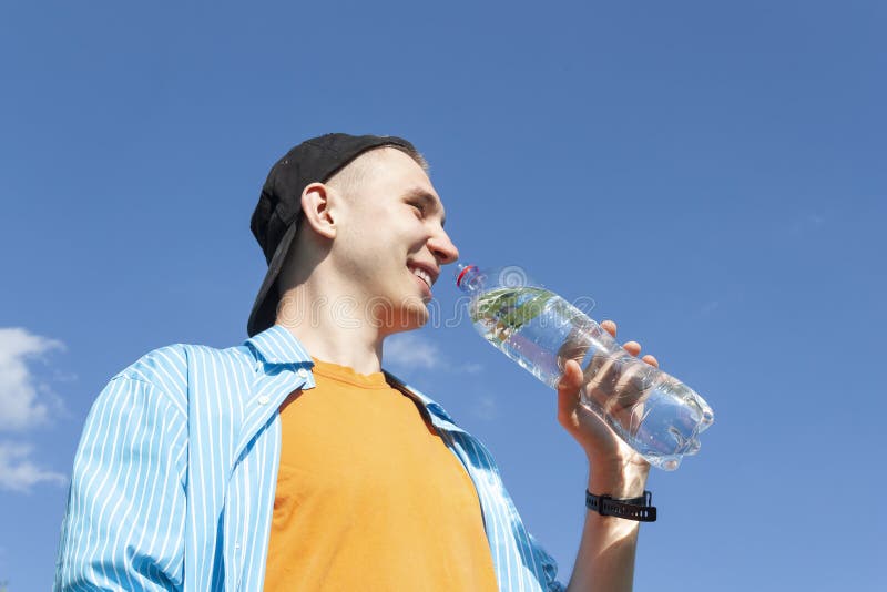 https://thumbs.dreamstime.com/b/guy-drinks-pure-water-bottle-against-clear-sky-lower-angle-close-up-guy-drinking-water-bottle-against-blue-158990554.jpg