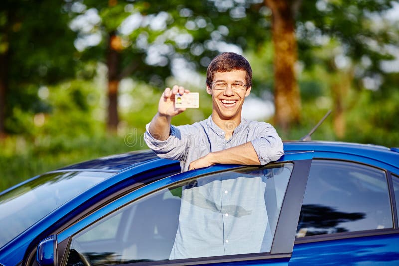 Car license. Парень с правами в руках. Юноша с правами. Мужчина с водительскими правами. Право фото.