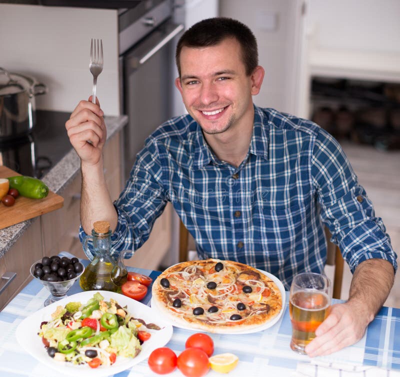 Young Guy Eating Pizza Salad Kitchen Home Stock Photos Free & RoyaltyFree Stock Photos from