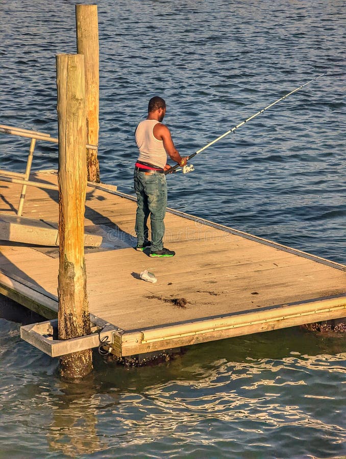 A Guy Fishing at a Floating Dock Editorial Stock Photo - Image of weaver,  vehicle: 246557003