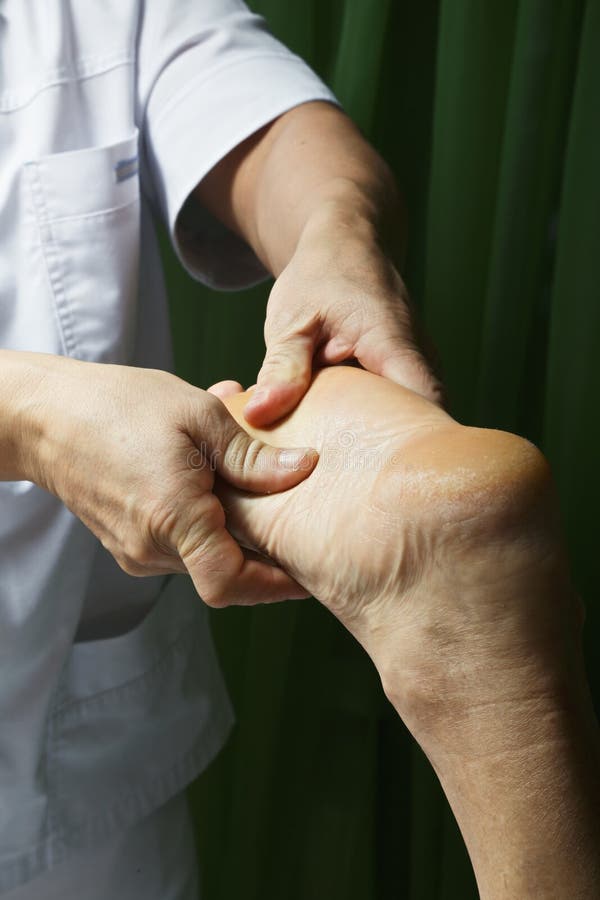 Guy foot massage closeup stock image. Image of therapy 111039093